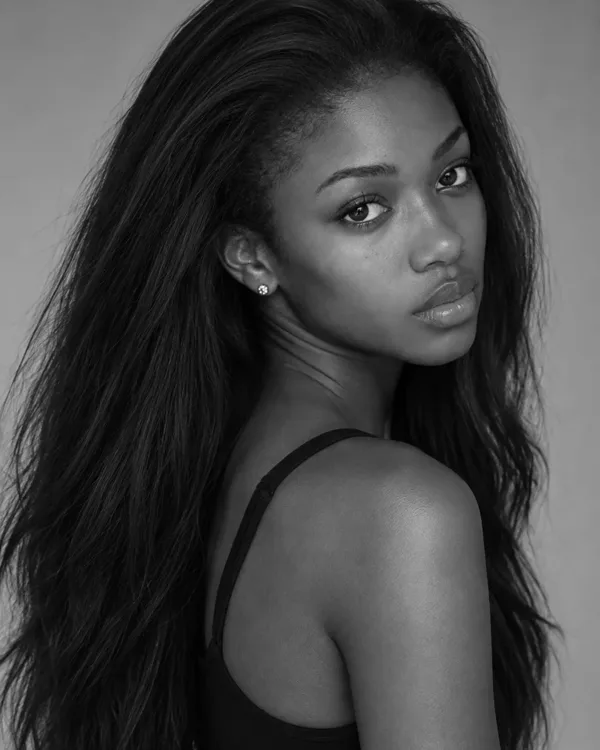 Three black and white portraits of three different models, a close-up, a half length and a full length, the kinds of photos used on a comp card