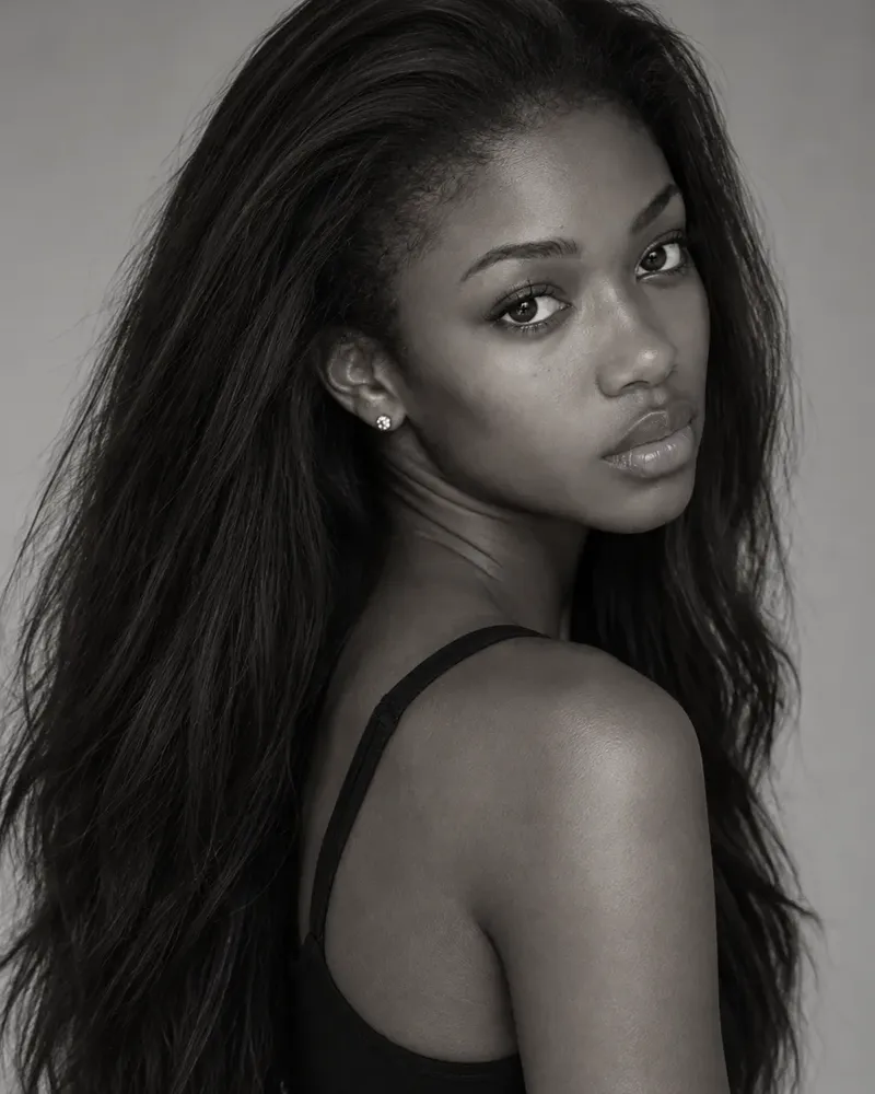 Three black and white photos of a model, laid out as they would be on a comp card